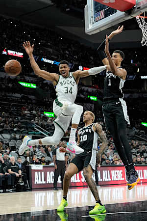Jan 4, 2024; San Antonio, Texas, USA; Milwaukee Bucks forward Giannis Antetokounmpo (34) loses control of the ball while driving to the basket against San Antonio Spurs forward Victor Wembanyama (1) during the first half at Frost Bank Center.